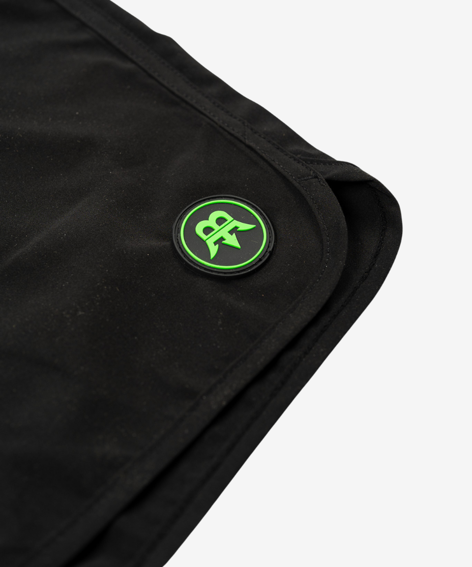 Detailed view of the seams on Born Maniac men's surfwear board shorts, showcasing the high-quality stitching and durable construction for active use.