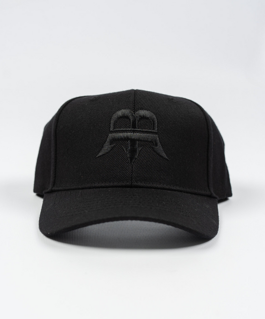 Unisex black snapback hat made from durable woven wool fabric, featuring a subtle black Born Maniac logo on the front.