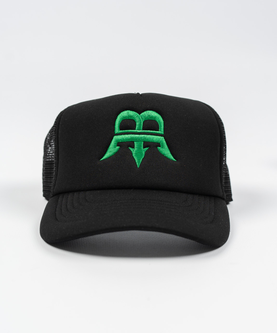 Unisex black trucker cap with a green Born Maniac logo on the front, made from durable wool fabric with a breathable mesh panel and an adjustable rear strap for one-size-fits-all convenience.