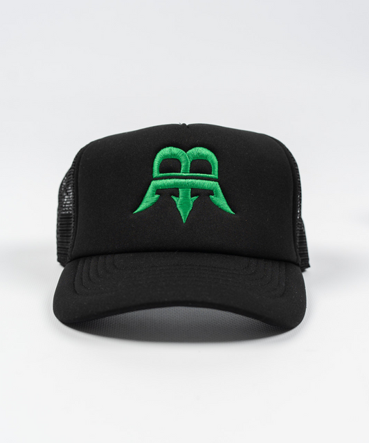 Unisex black trucker cap with a green Born Maniac logo on the front, made from durable wool fabric with a breathable mesh panel and an adjustable rear strap for one-size-fits-all convenience.